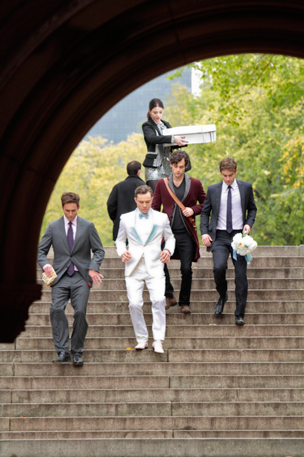 Chuck Bass (played by Ed Westwick-in a tuxedo custom made by Martin Greenfield, Eton shirt, Dolce and Gabbana shoes, and Bruno Piatelli socks) races through New York City's Central Park to get to his bride-to-be Blair Waldorf (Leighton Meester) before the Police get to her first!